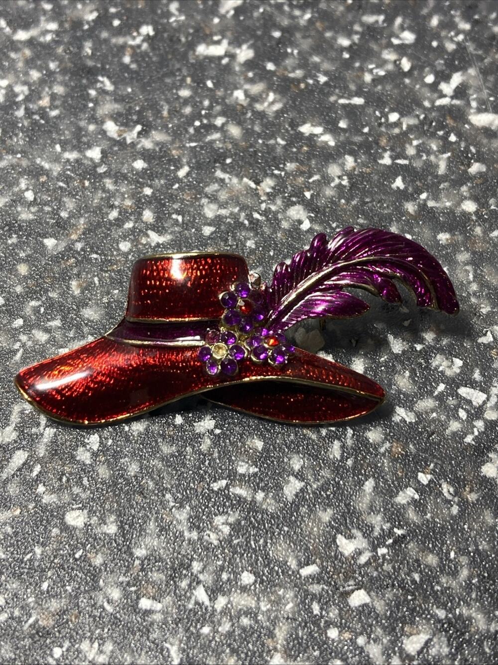 Red Hat brooch with feather, about 2 in long, see pics